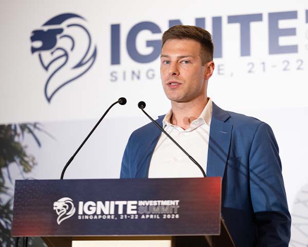 CEO presenting during the Ignite Investment Summit April 2026 at the Fullerton Hotel in Singapore