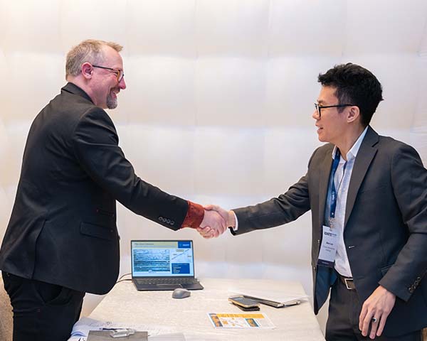 A corporate and investor shaking hands at the Ignite Investment Summit Singapore 2026